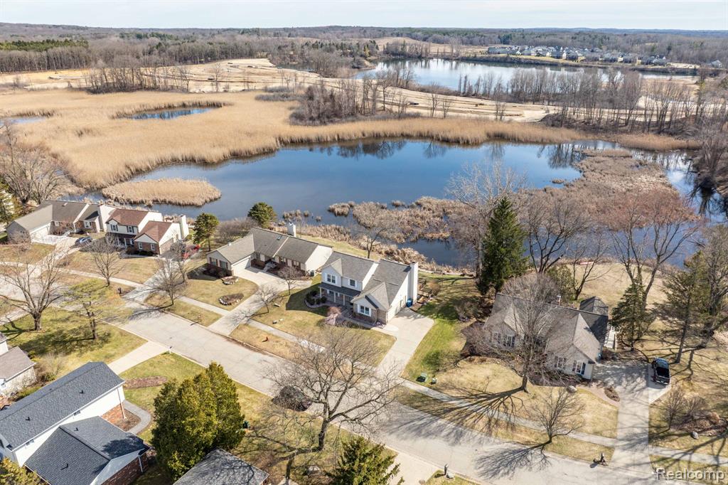 Aerial view of residential area with a nearby body of water