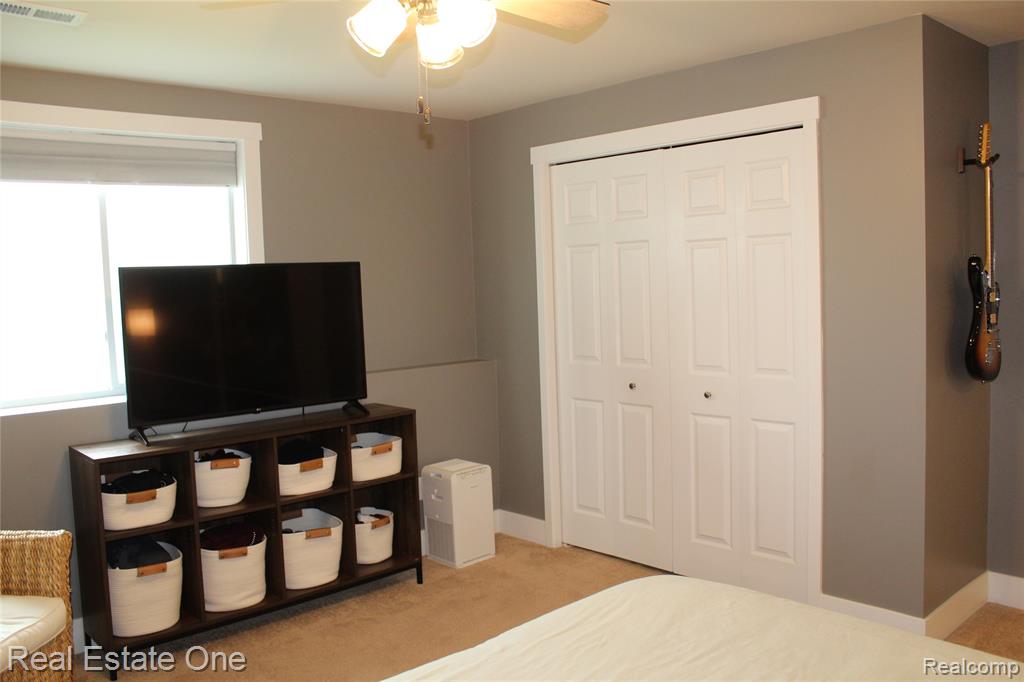 8662 Pinnebog River Drive, Fowlerville, MI 48836 — Photo 18