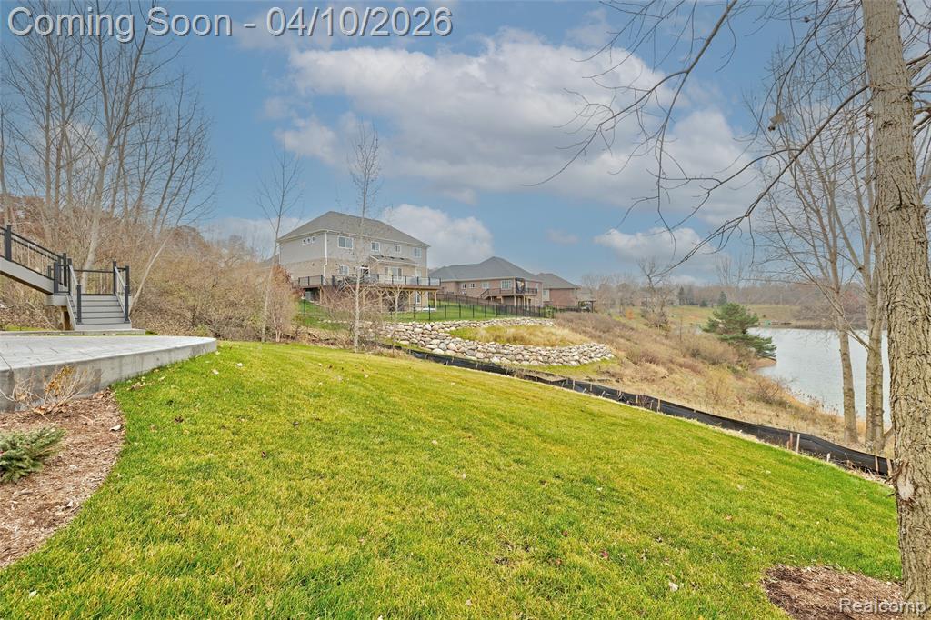 View of yard with a water view