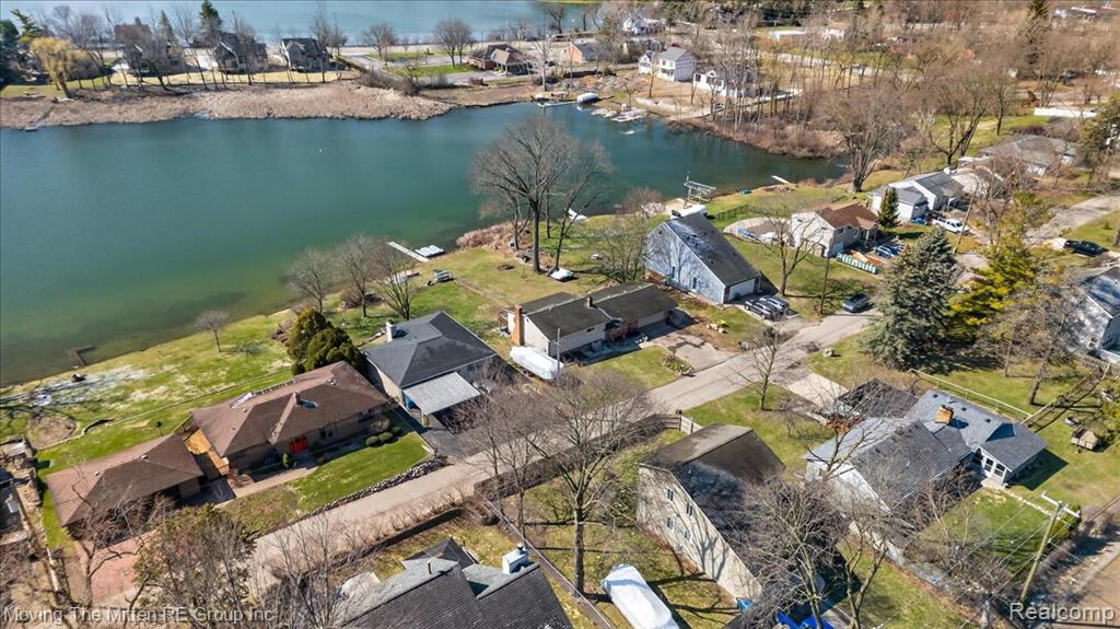 Aerial perspective of suburban area with a large body of water