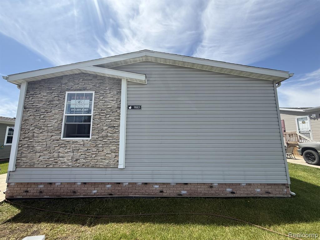 9885 Bellcrest Boulevard, Fenton, MI 48430 — front exterior
