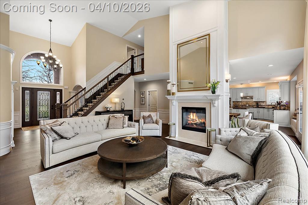 2 Story Living Room w/Double Sided Fireplace & Custom Millwork