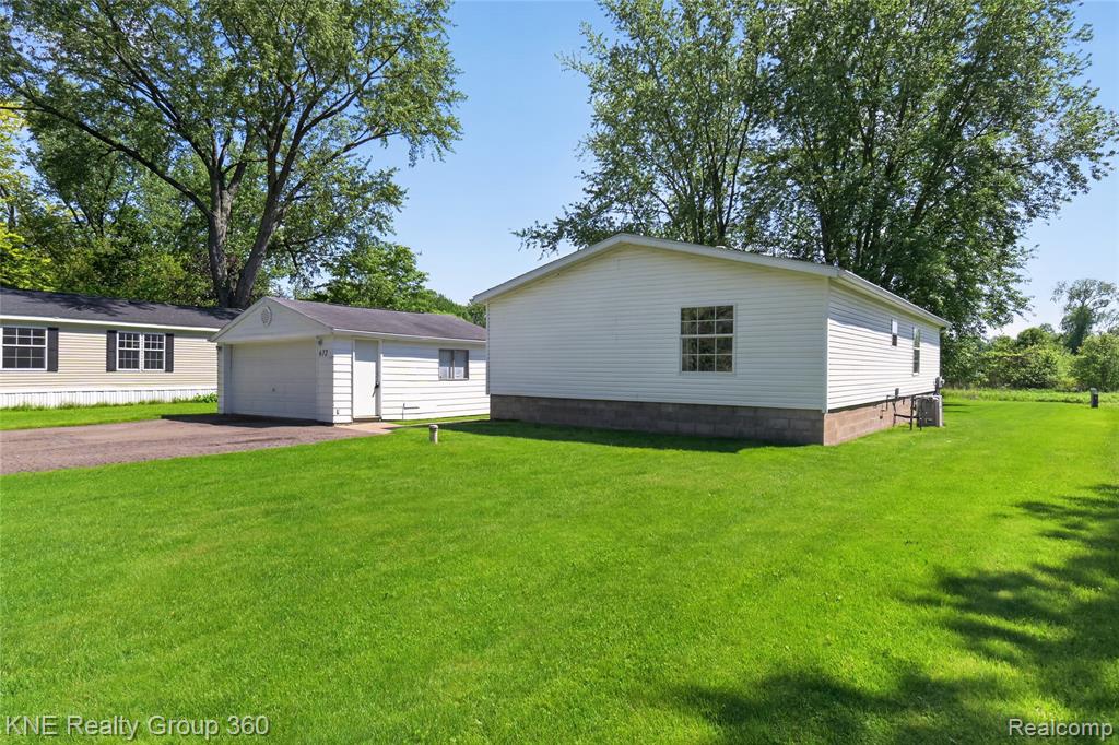 672 Red Oaks Drive, Howell, MI 48843 — Photo 2