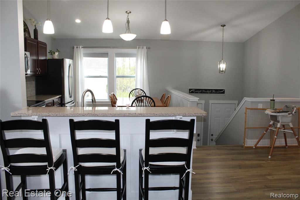 8662 Pinnebog River Drive, Fowlerville, MI 48836 — Photo 9