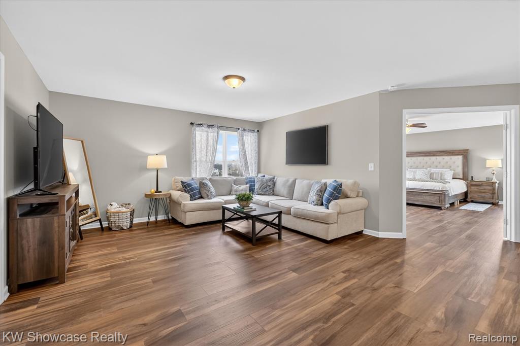Living area featuring wood finished floors and baseboards