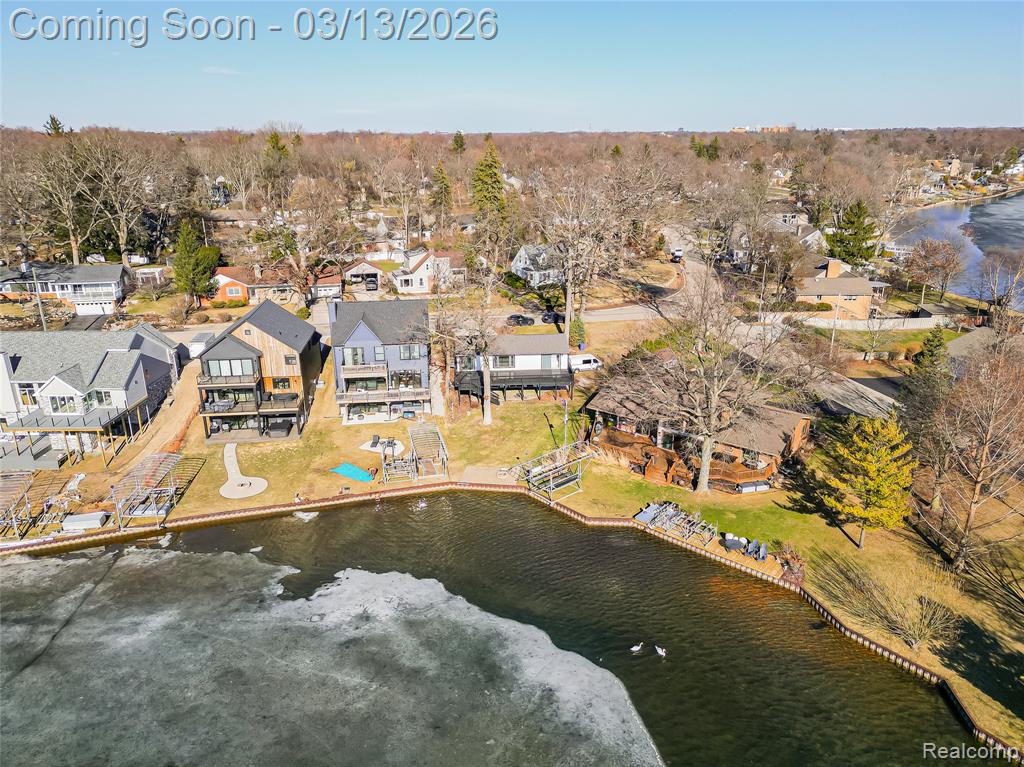 Aerial view of residential area with a nearby body of water
