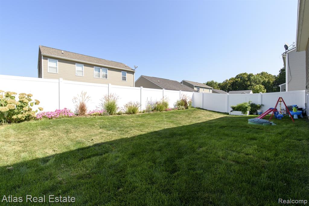 8582 Pinnebog River Drive, Fowlerville, MI 48836 — Photo 5