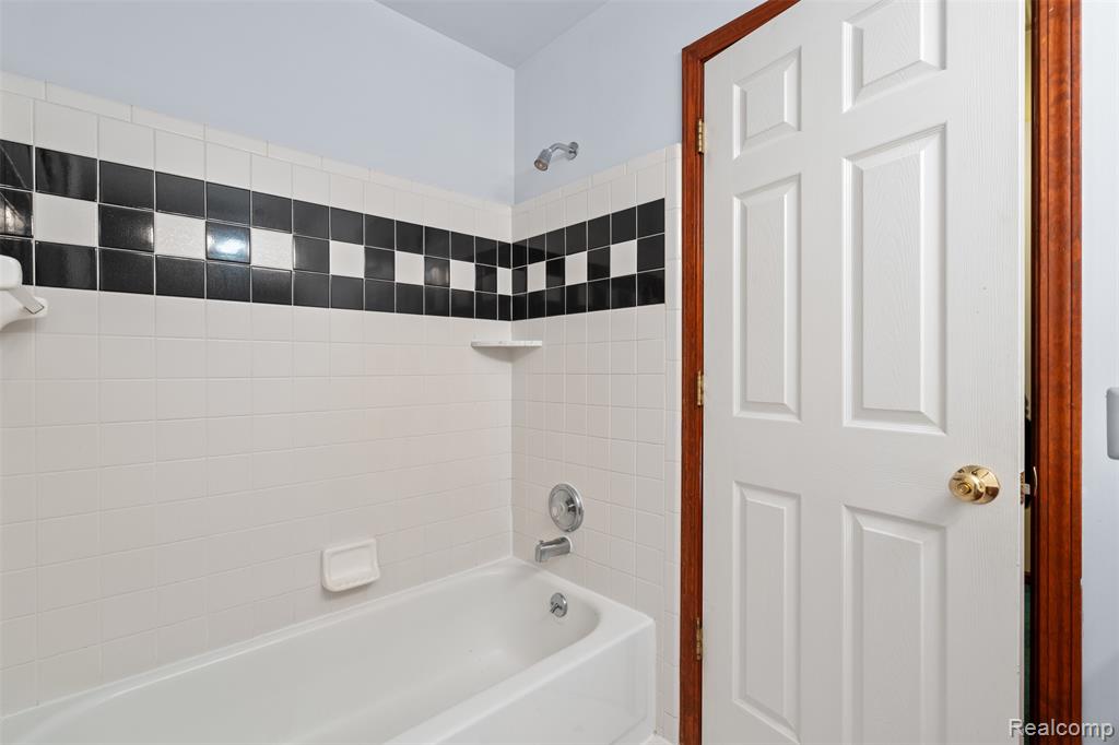 Full bathroom with shower / bath combination
