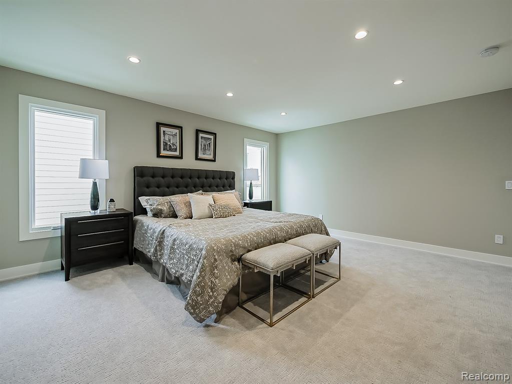 Bedroom featuring light colored carpet and recessed lighting