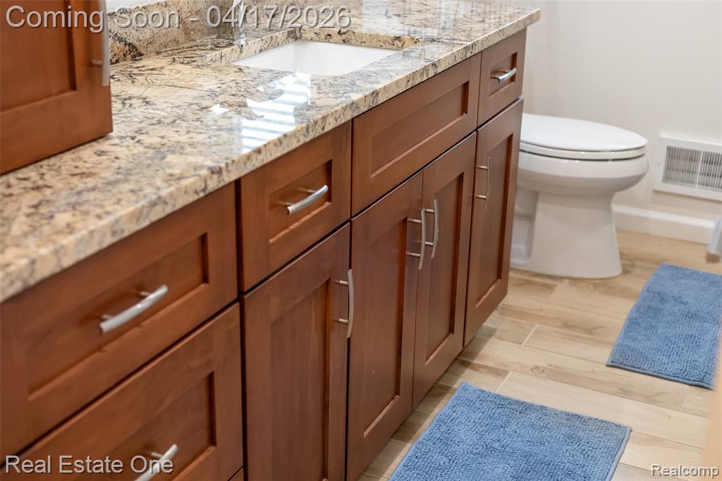 Bathroom featuring light wood-type flooring and vanity