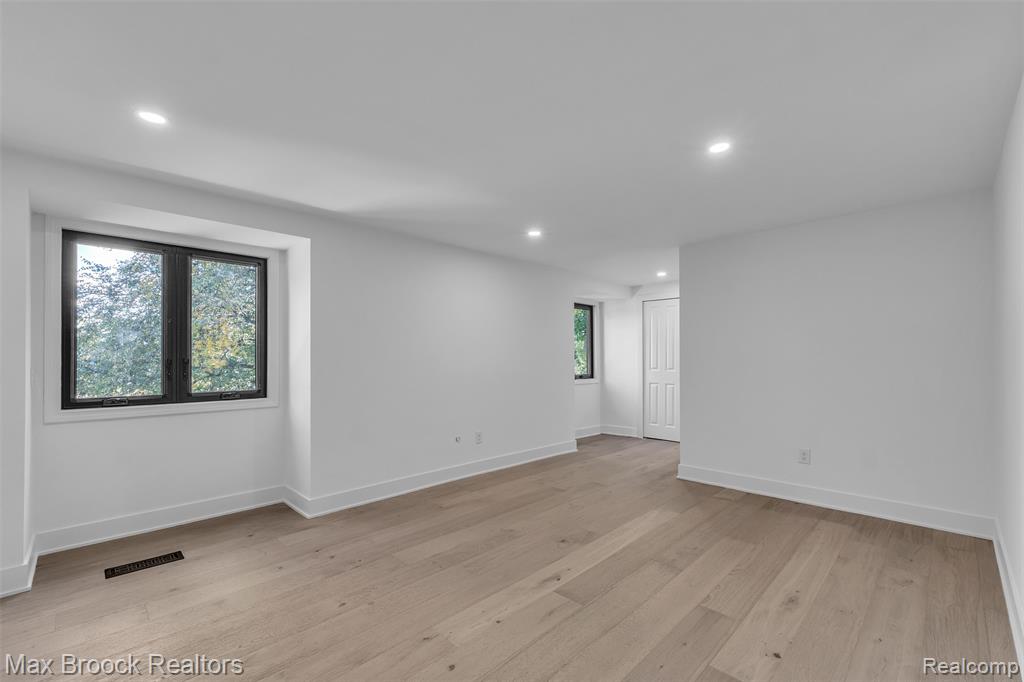 Empty room with recessed lighting and light wood-type flooring