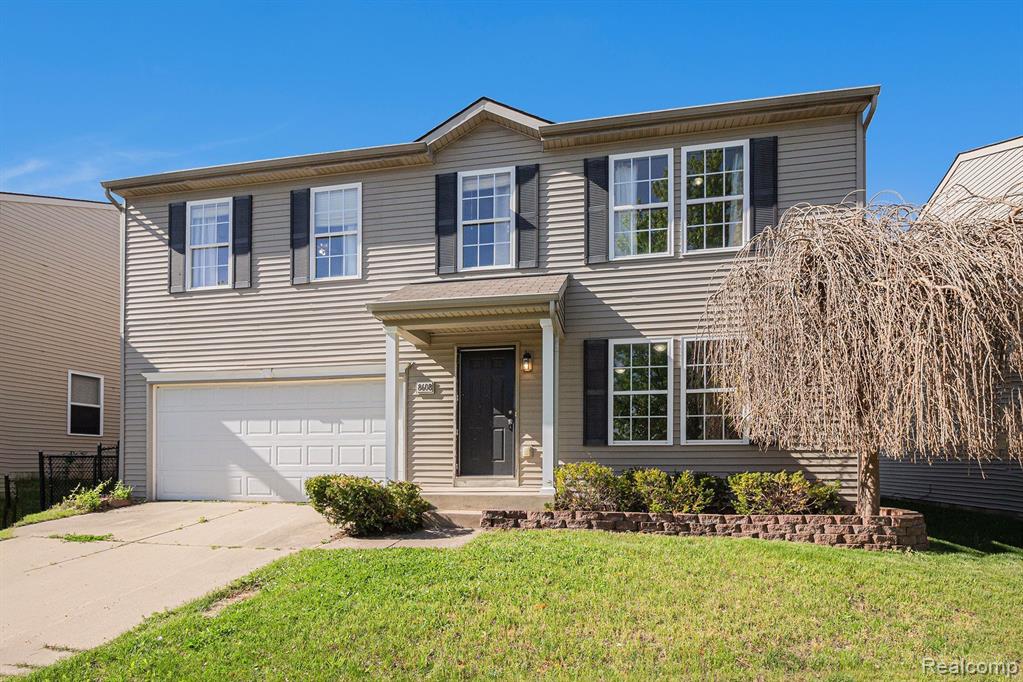 8608 RIFLE RIVER Drive, Fowlerville, MI 48836 — front exterior