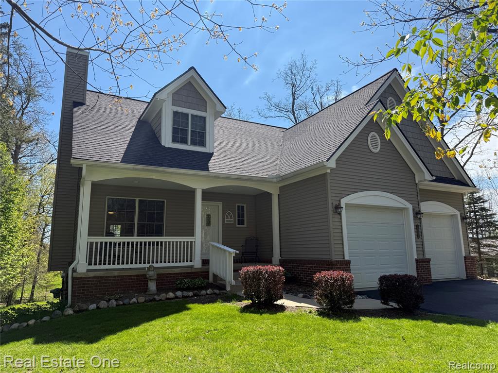 1374 Blue Heron Drive, Highland, MI — front exterior