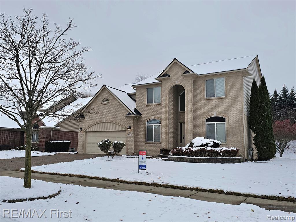 8564 Washington Woods Drive, Washington, MI — front exterior