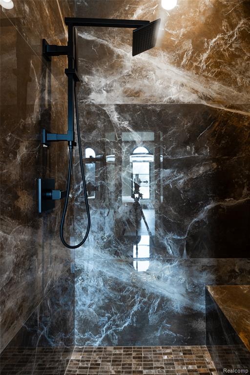 Bathroom view of a marble finish shower