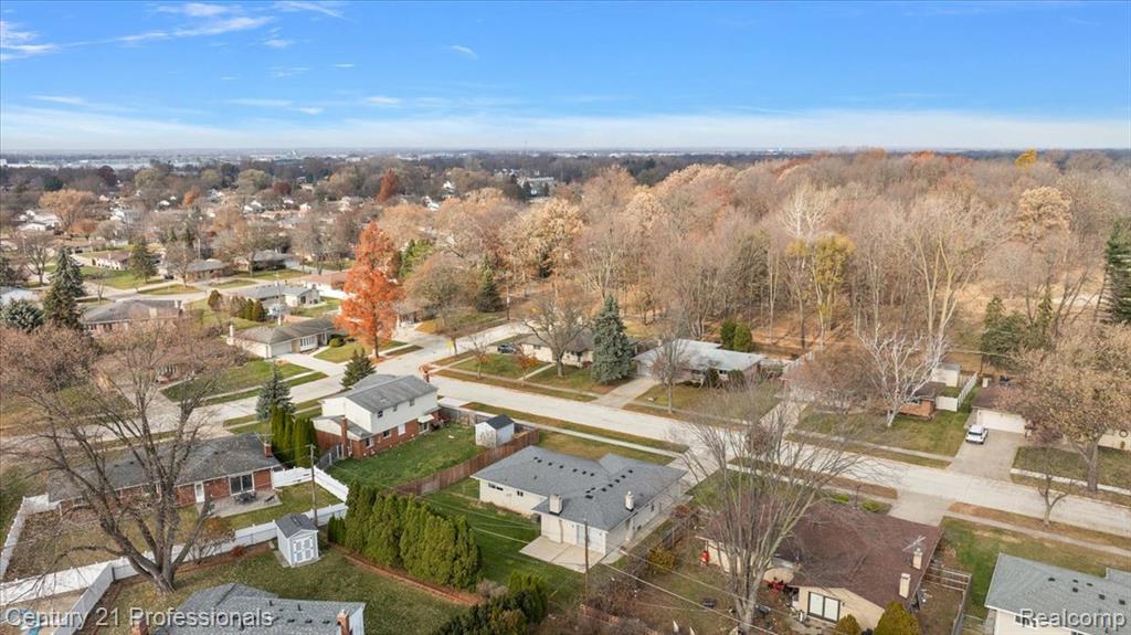 Aerial view of property's location featuring nearby suburban area