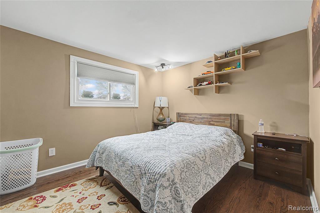 Bedroom featuring dark wood-type flooring