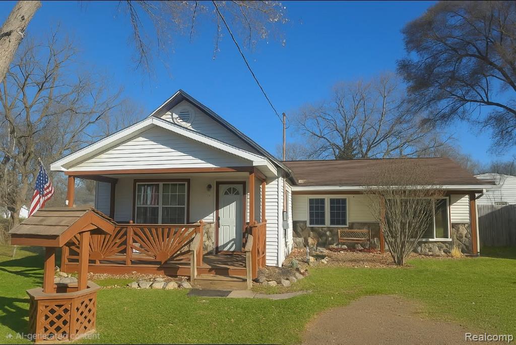 Photo for 207 Maple Street, Durand, MI 48429 - listing #20251053743 View of front facade featuring a front lawn and covered porch