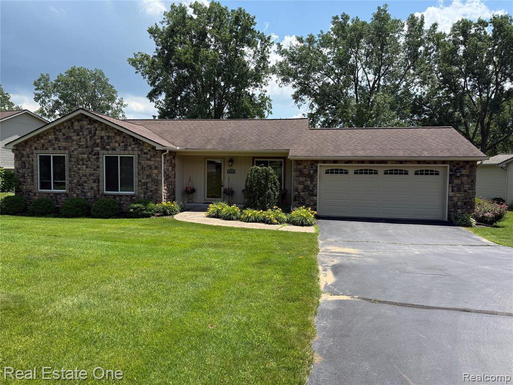4074 Loch Drive, Highland, MI — front exterior