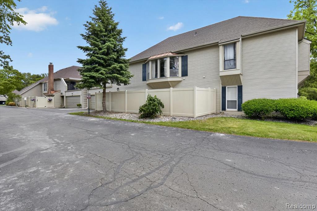 8127 Colony Drive, 21, Grosse Ile, MI 48138 — front exterior
