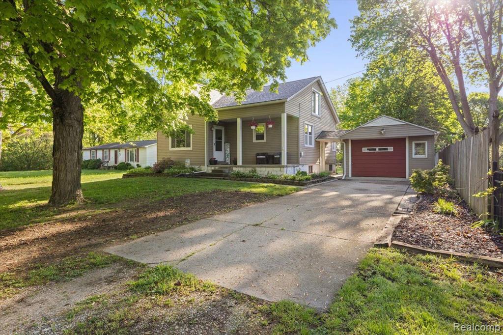 8869 MERIDIAN Street, Willis, MI 48191 — front exterior