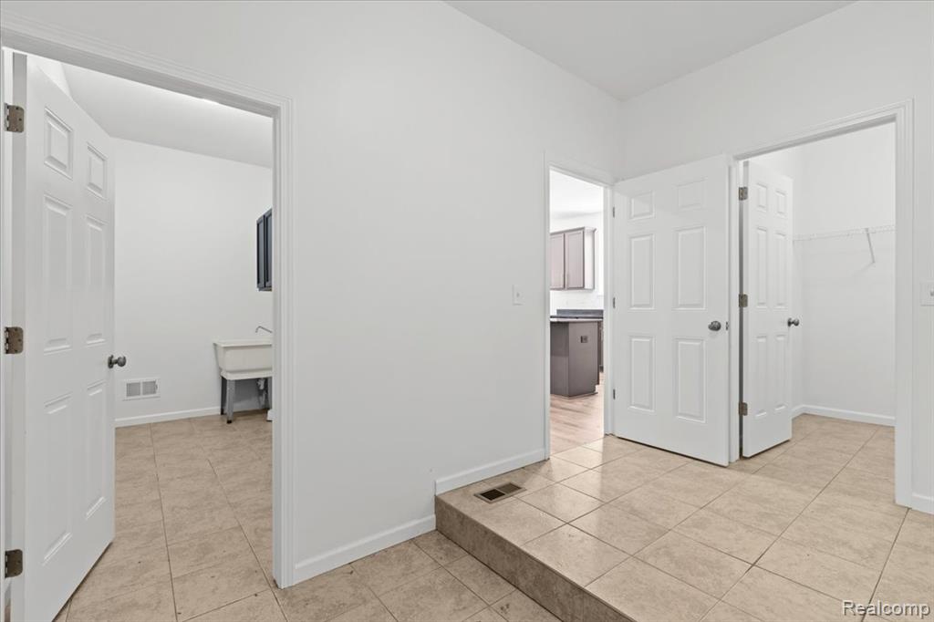 Office space featuring light carpet and baseboards