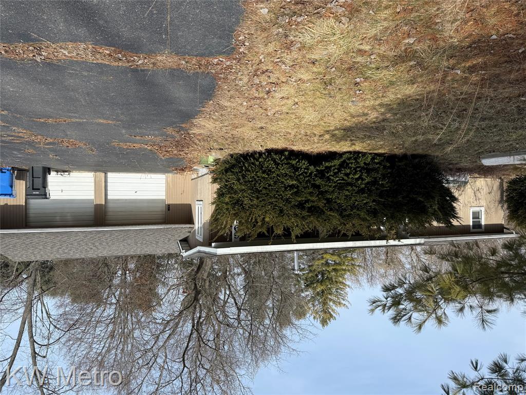 6915 Rink Drive, Brighton, MI 48114 — front exterior