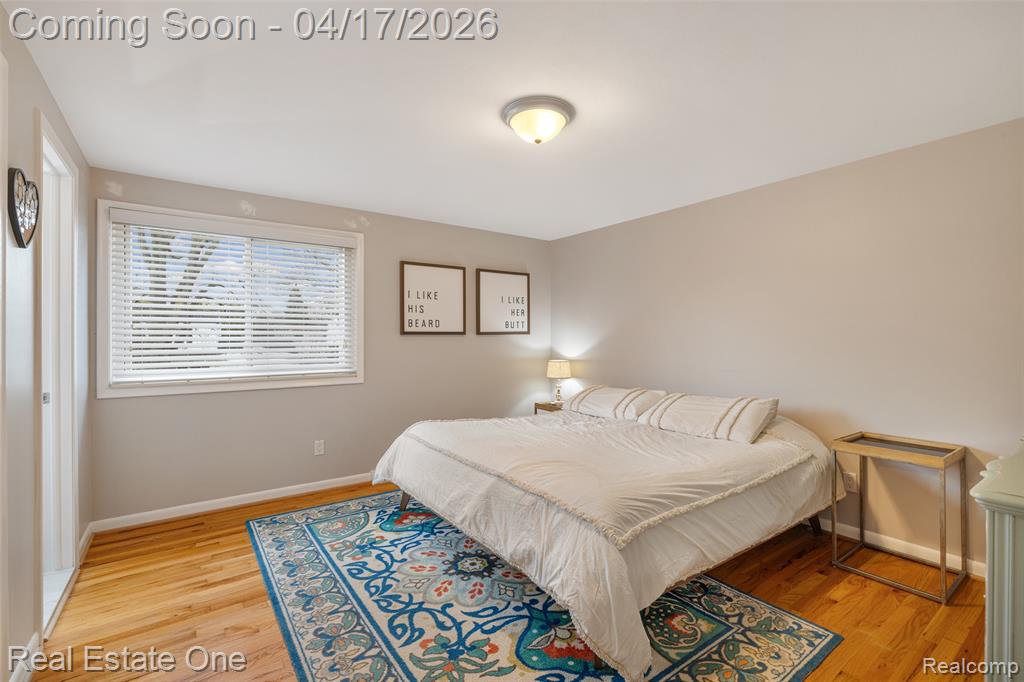 Bedroom featuring baseboards and light wood-style flooring