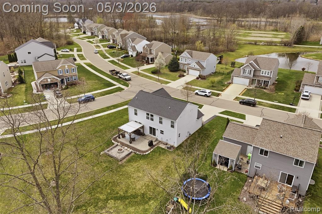 Aerial view of residential area with a large body of water