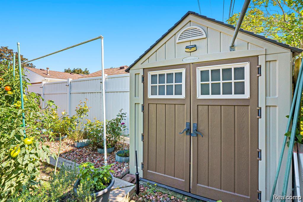 View of shed featuring a fenced backyard