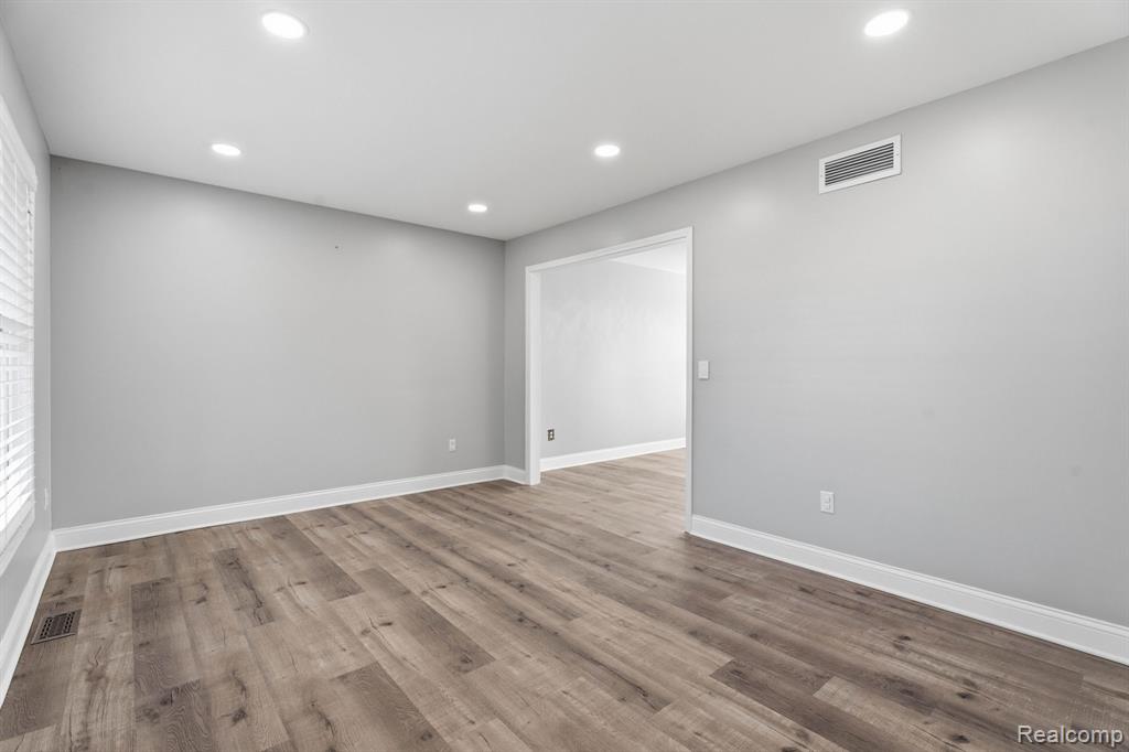 Spare room featuring recessed lighting and light wood-style flooring