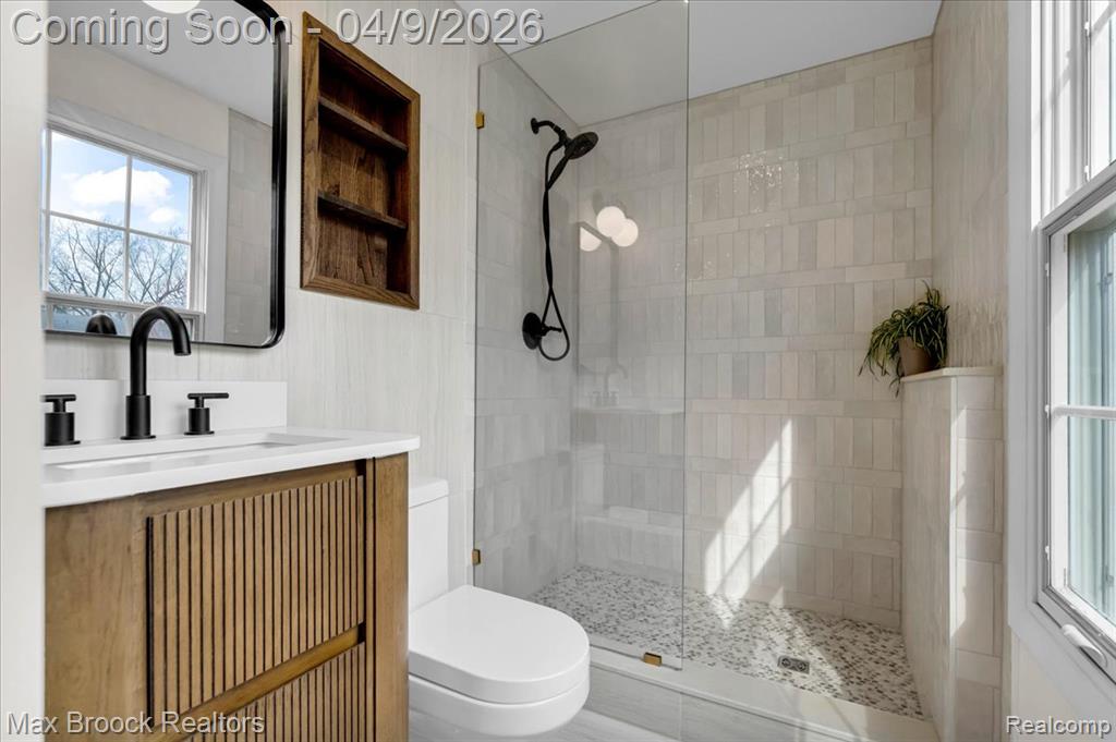 Bathroom with vanity and a walk in shower