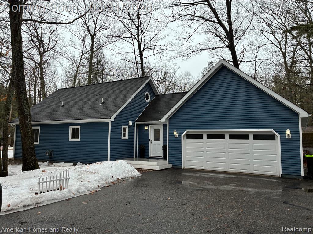 217 Arbutus Lane, Roscommon, MI 48653 — front exterior