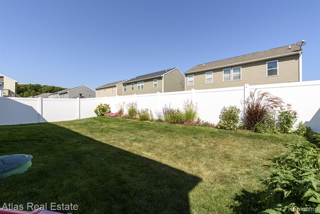 8582 Pinnebog River Drive, Fowlerville, MI 48836 — Photo 6