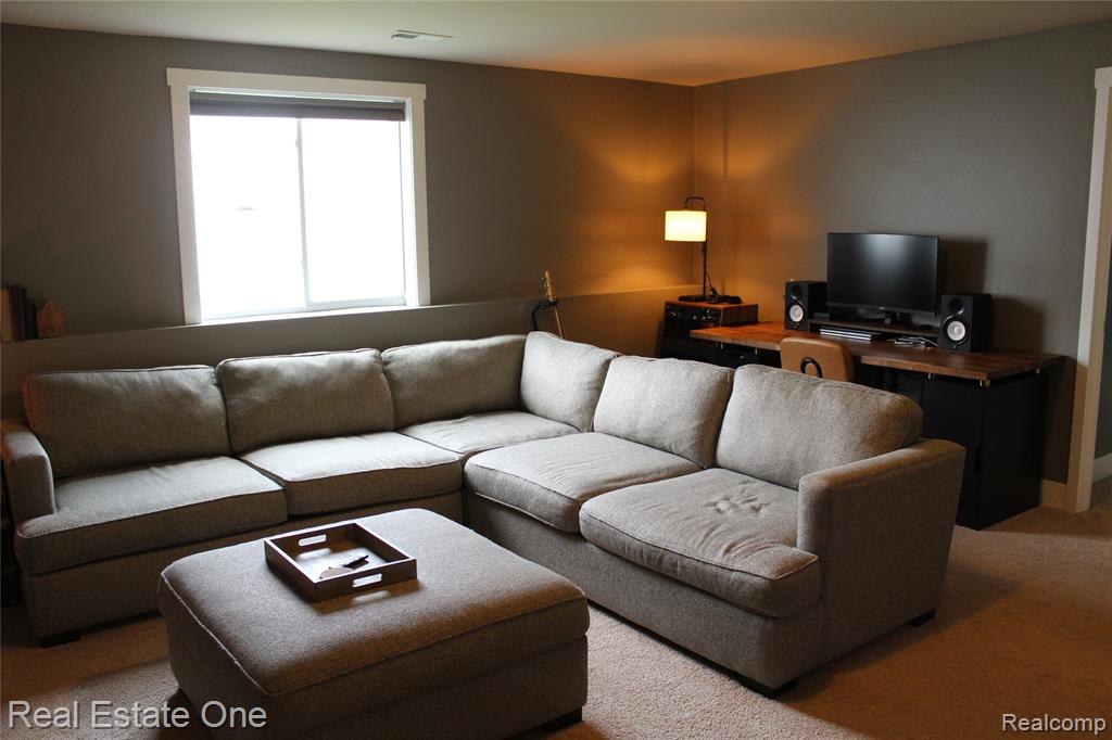 8662 Pinnebog River Drive, Fowlerville, MI 48836 — Photo 16