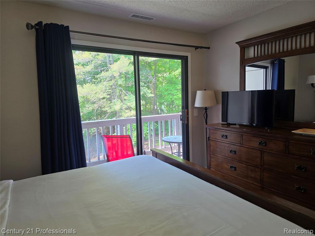 5714 Creeks Crossing, Williamsburg, MI 49690 — Photo 16