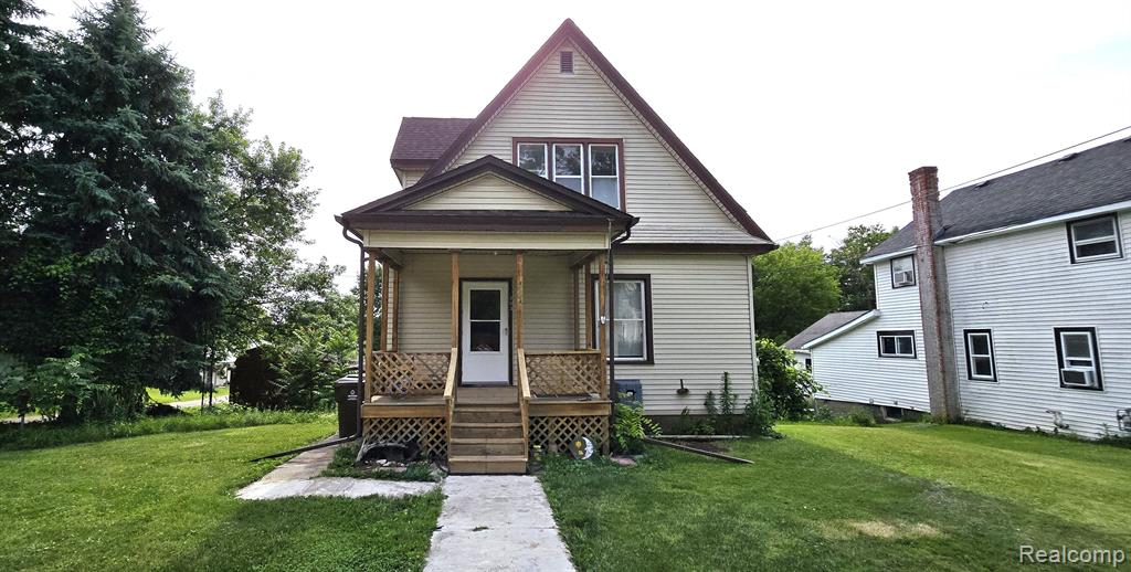 303 N SHIAWASSEE Street, Bancroft, MI 48414 — front exterior