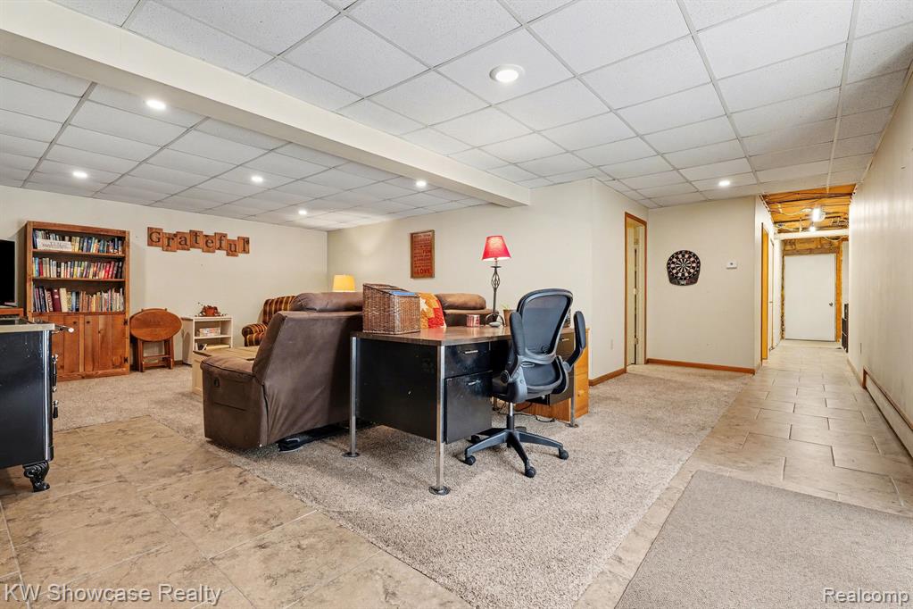 Office featuring a drop ceiling, light carpet, recessed lighting, and light tile patterned floors