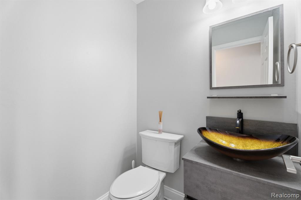 Half bath with toilet and vanity
