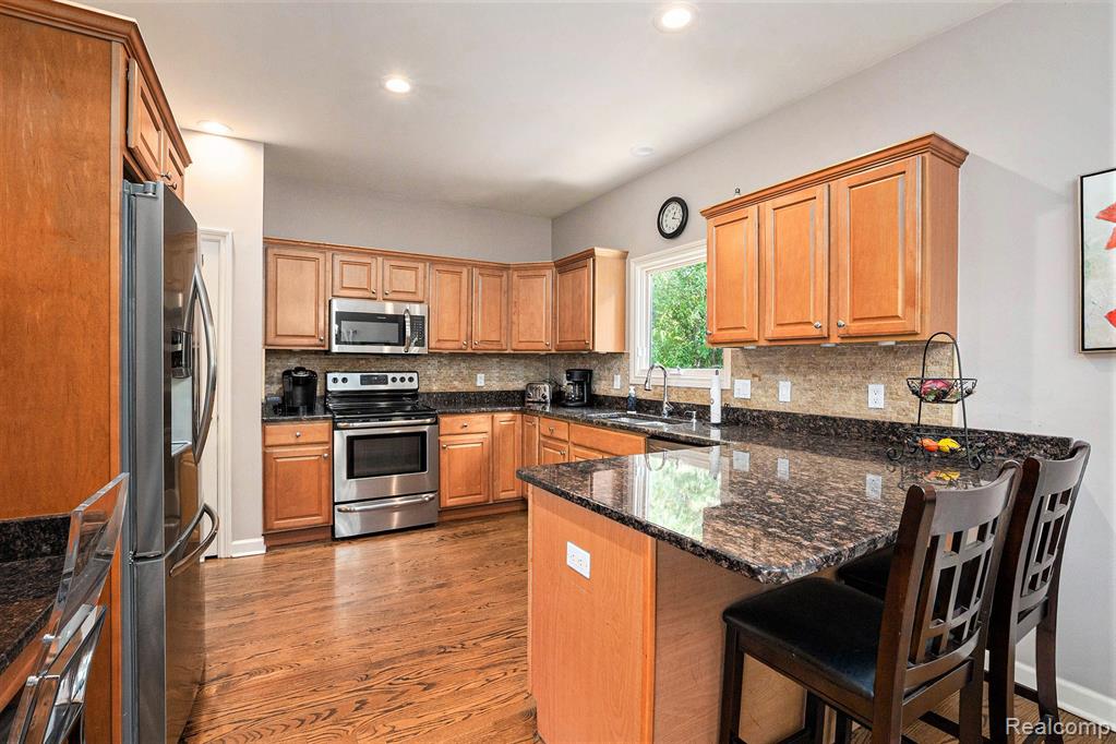 1799 Elkridge Circle, Highland, MI 48356 — Photo 13
