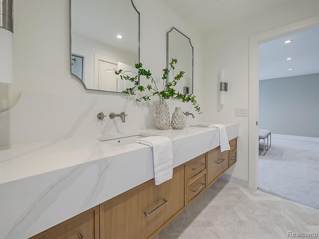 Bathroom featuring double vanity and recessed lighting