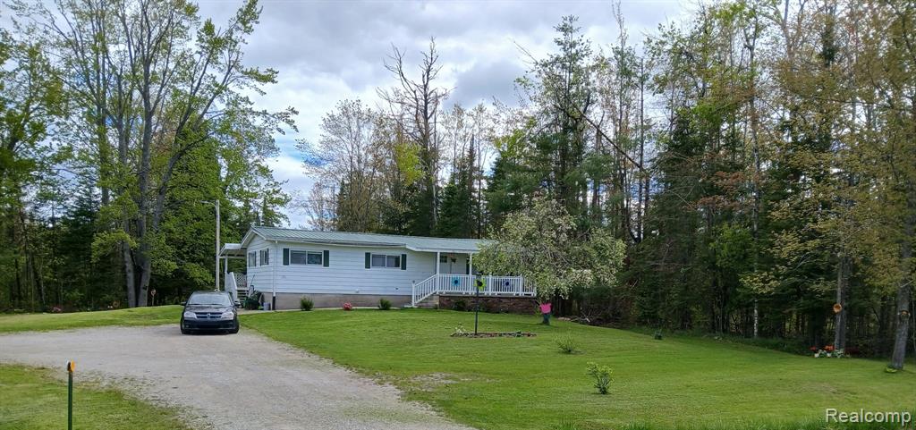 11255 Long Rapids Road, Lachine, MI 49753 — front exterior