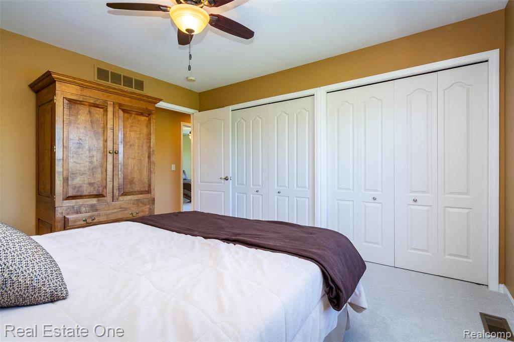 4th Bedroom featuring multiple closets and ceiling fan