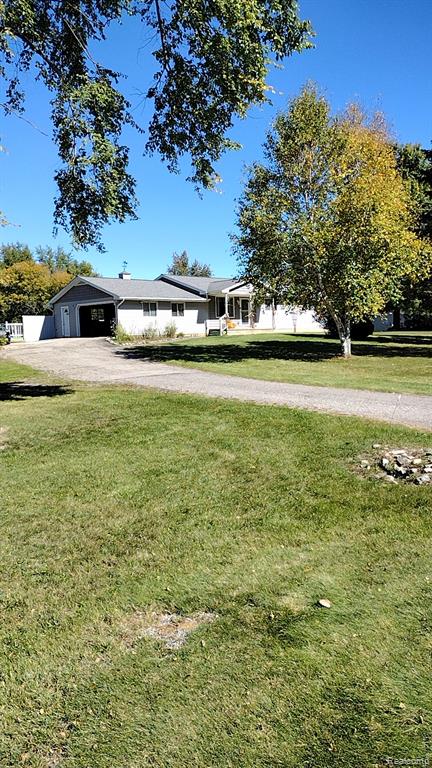 9766 Amanda Drive, Fowlerville, MI 48836 — front exterior
