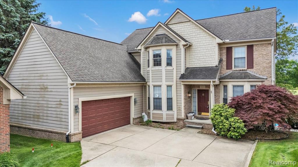7882 Glacier Club Drive, Washington, MI — front exterior
