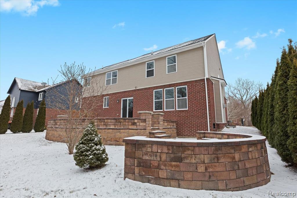 Snowy aerial view with a residential view