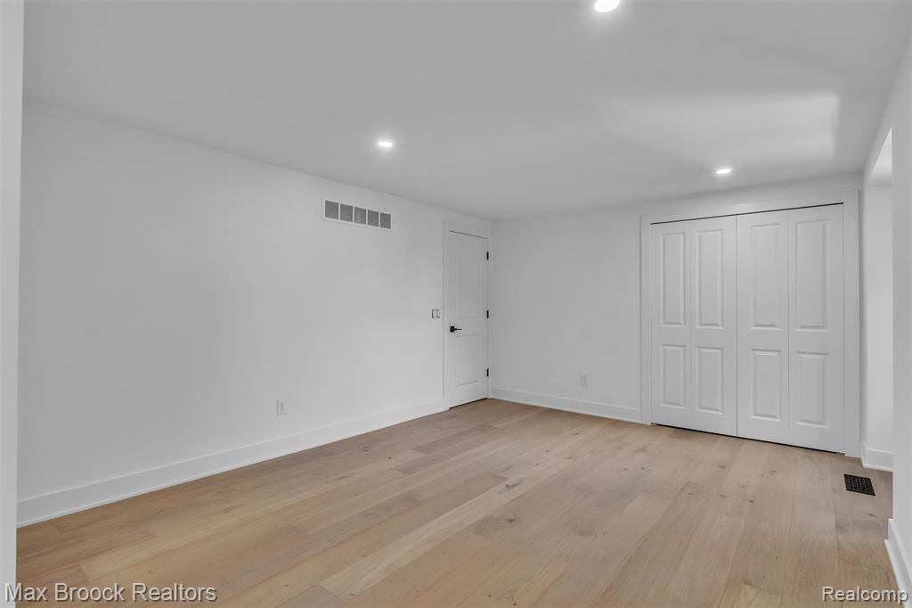 Unfurnished bedroom featuring recessed lighting, light wood-type flooring, and a closet