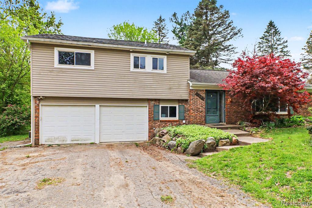 11465 Cedar Island Road, White Lake, MI — front exterior