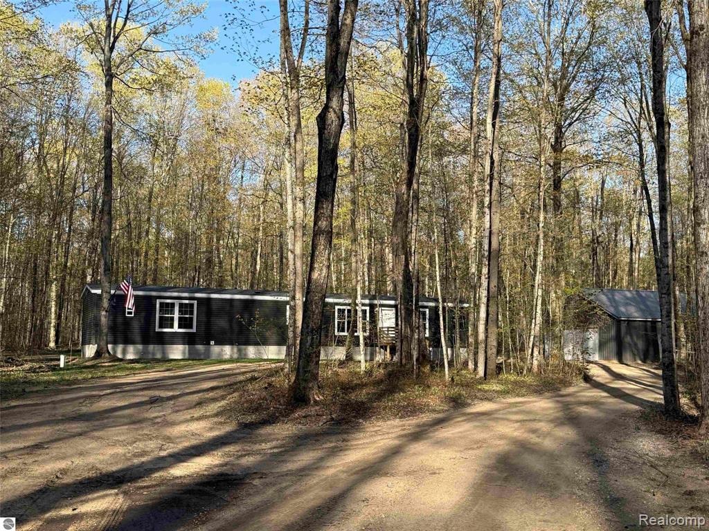 9710 S Fawn Lane NE, Mancelona, MI 49659 — front exterior