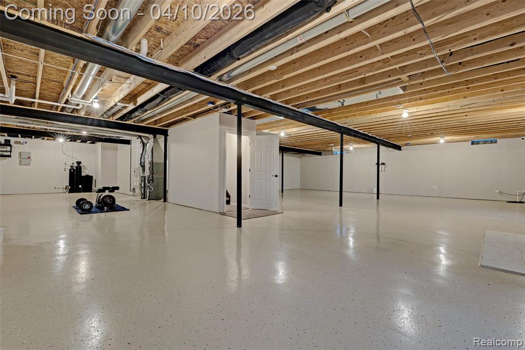 Unfinished basement with heating unit